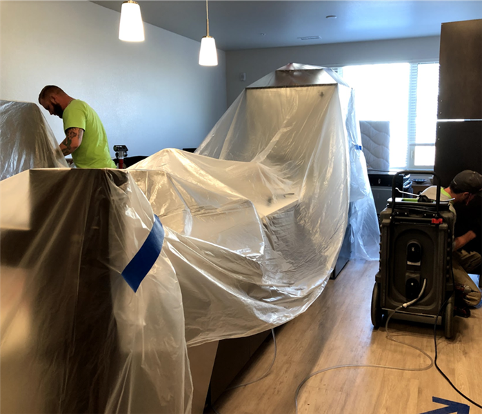 tarping covering the interior of an apartment 