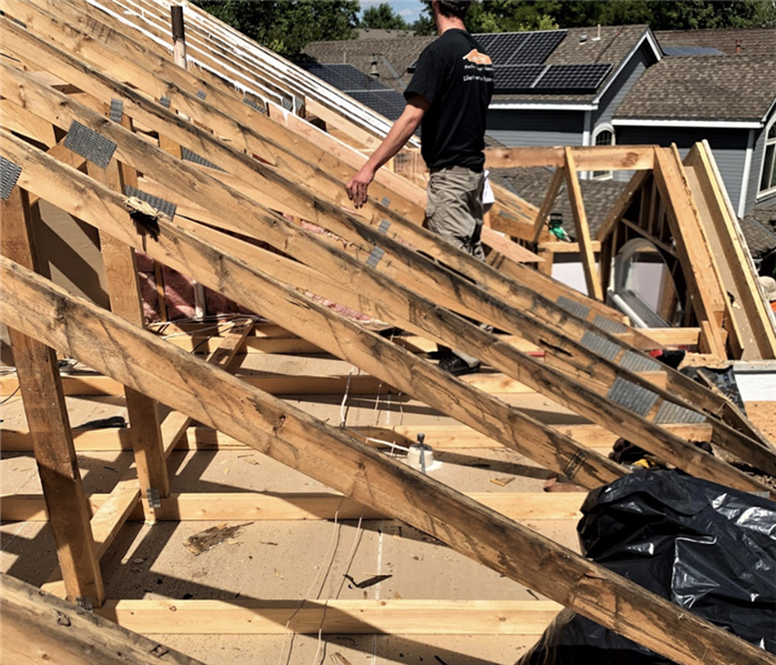 a roof in mid construction with the framing done 