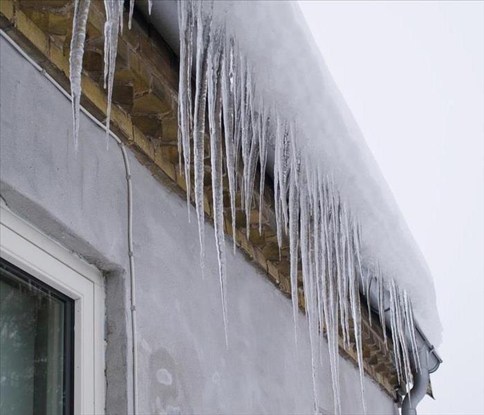 Icicles on a roof winter background image